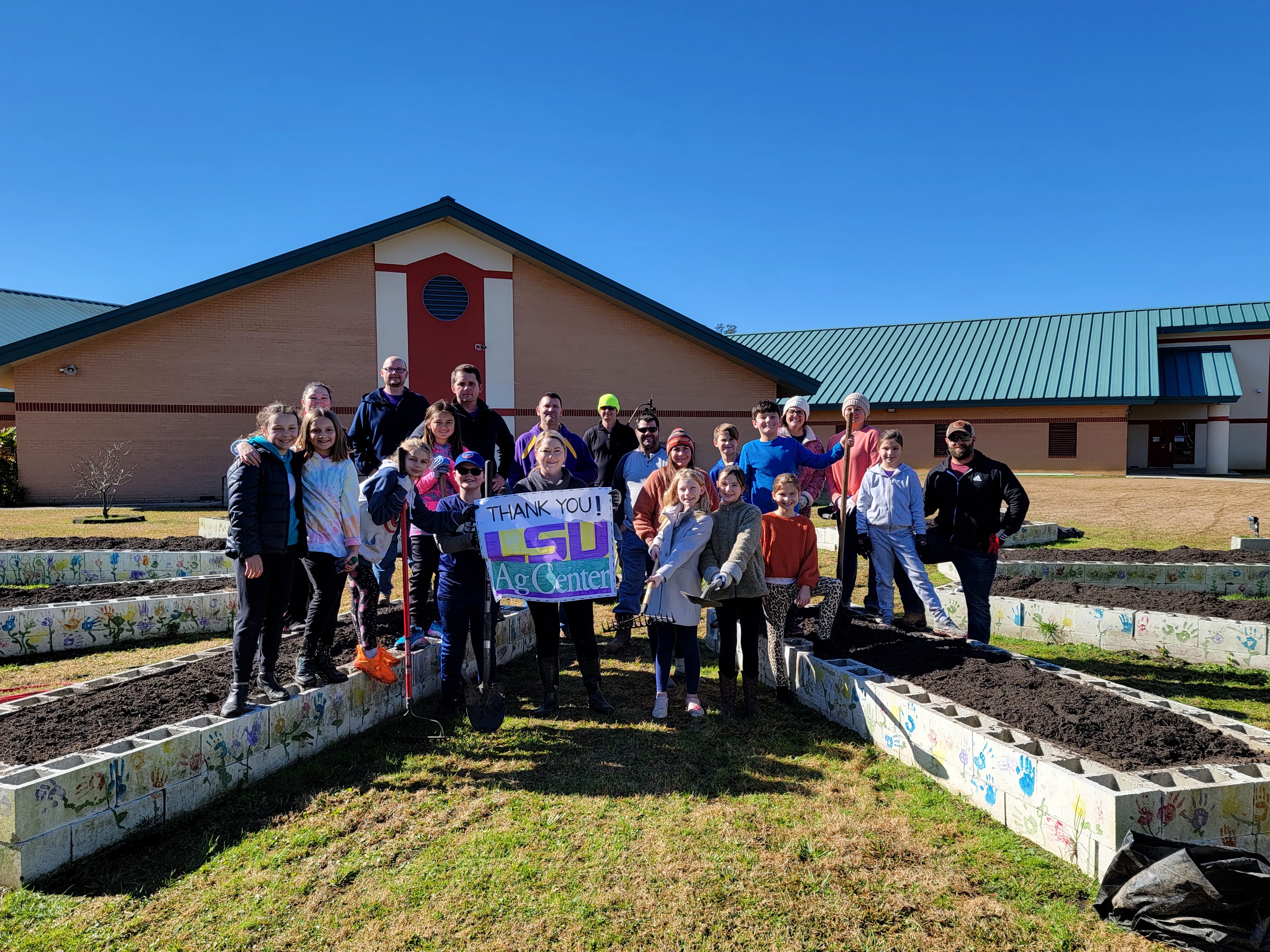 Students, teacher and volunteers at the Oak Grove School Garden.